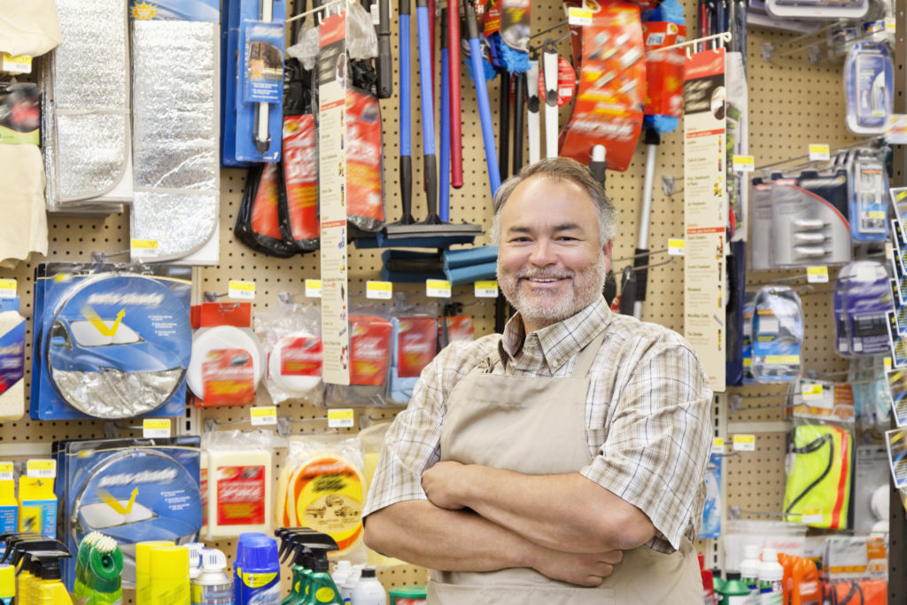 A happy man working in a shop