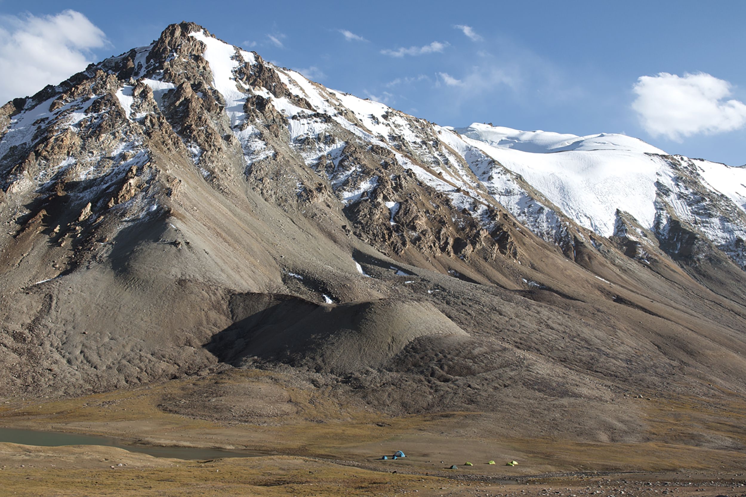 The highest camp of the Pamir mountain lakes trek at Langarkul Lake
