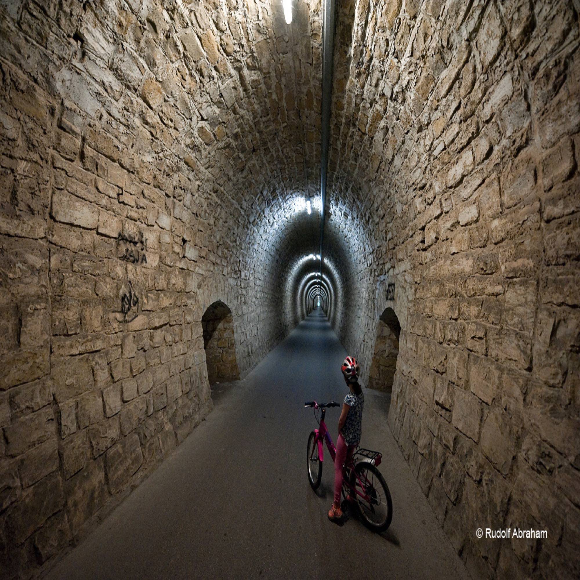 Cycling through the 550m Valeta tunnel near Piran, on the Parenzana cycle route, Slovenia © Rudolf Abraham